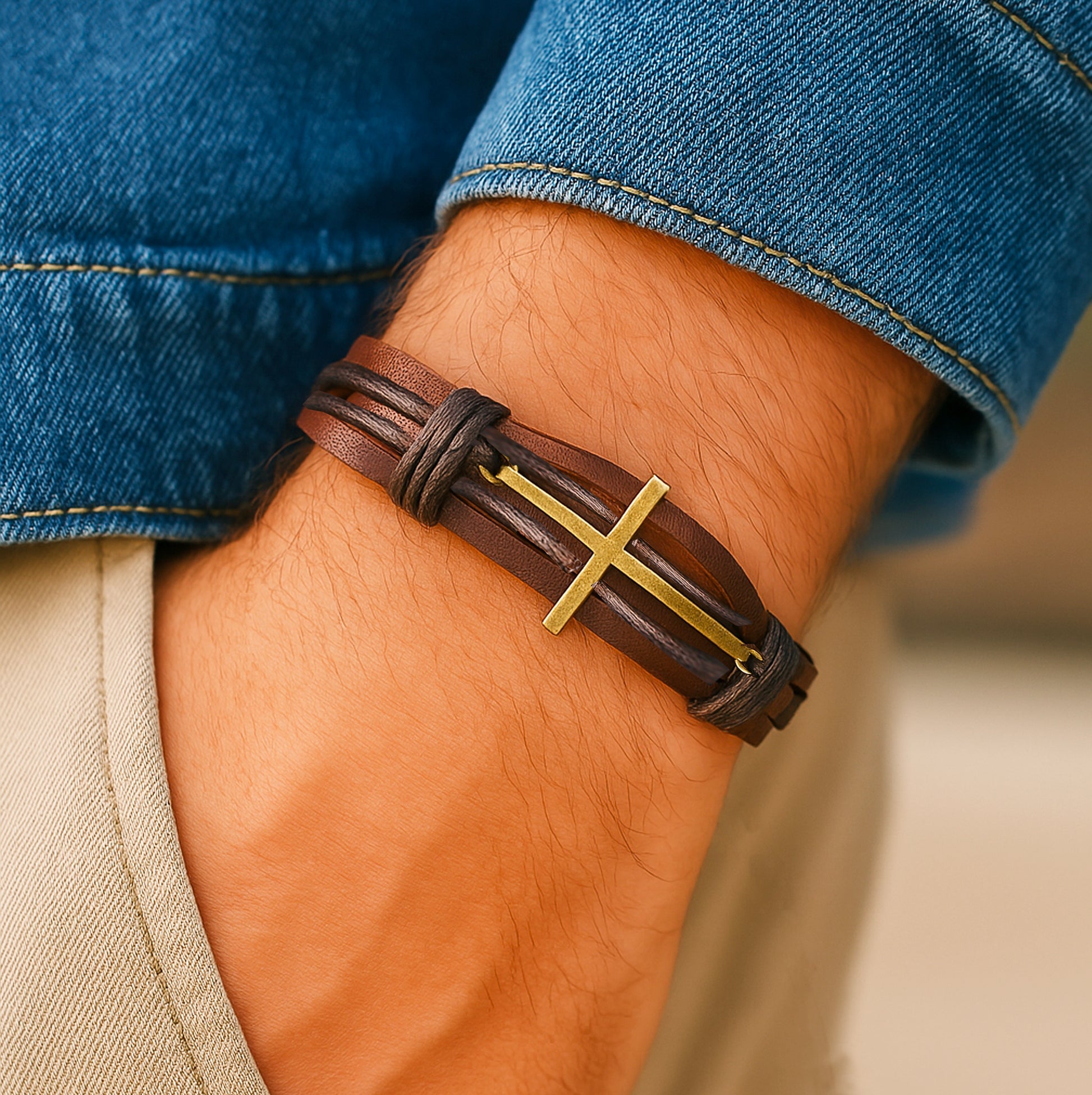 Men’s braided leather bracelet with cross – worn on wrist, casual outfit, Christian jewelry