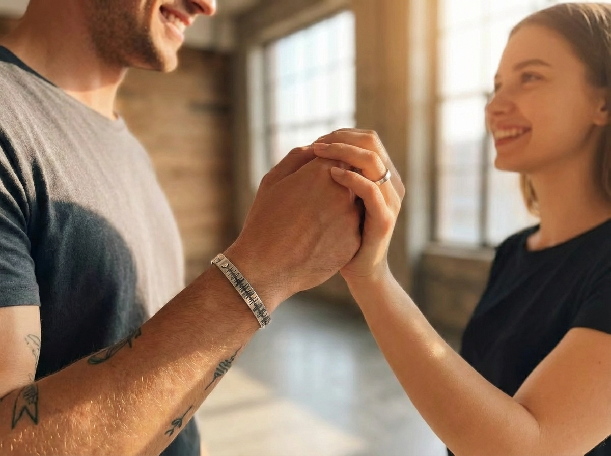 Couple wearing matching personalized soundwave leather bracelets